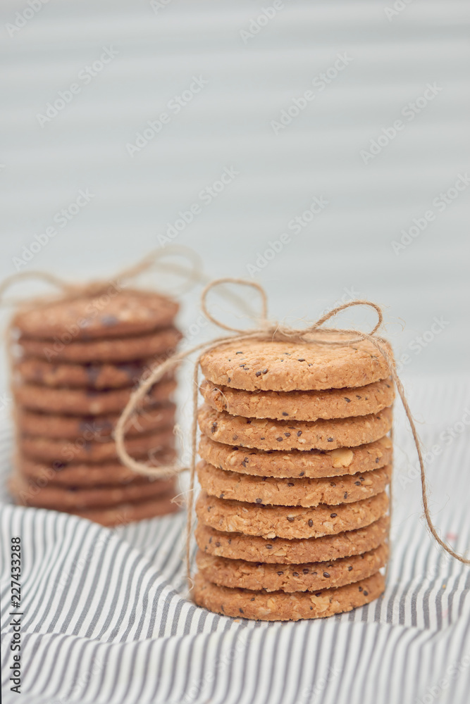 Cookie are stack and tied with twine. Delicious cookies on napkin background. Homemade cake. The nut