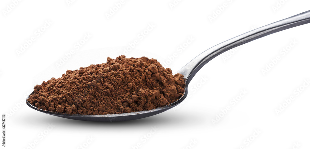 Cocoa powder in spoon isolated on white background. Top view