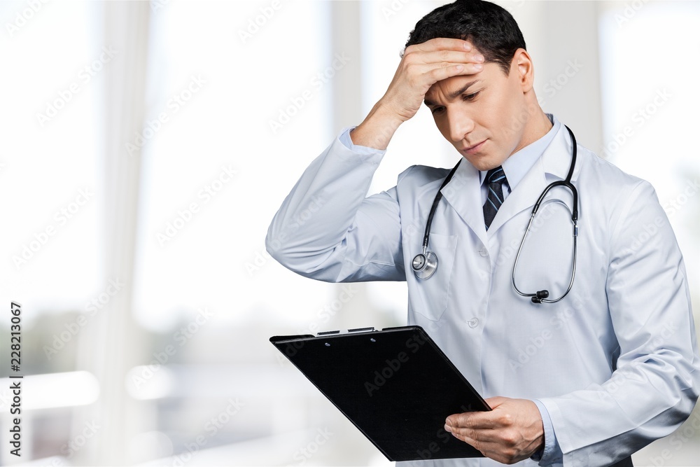 Handsome doctor portrait on  background