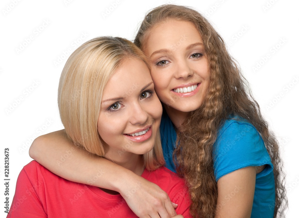 Portrait of Two Girlfriends / Sisters Hugging