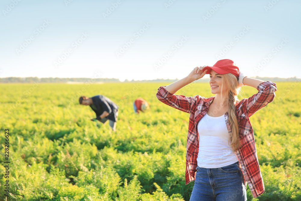 Portrait of female farmer in field