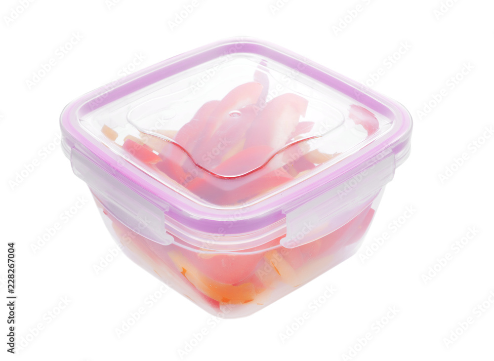 Plastic container with fresh pepper for freezing on white background