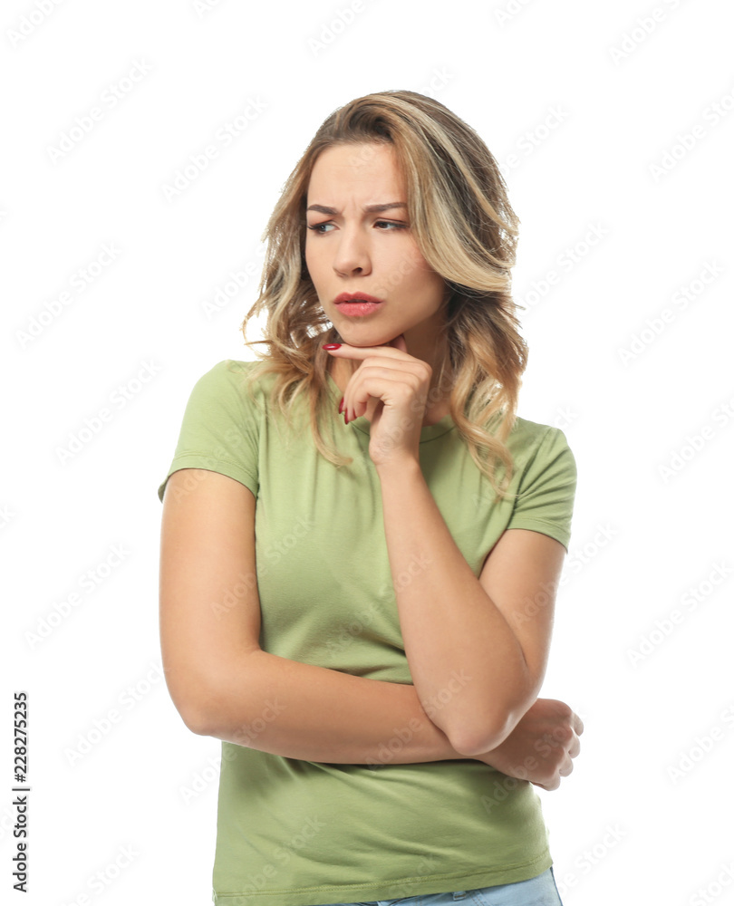 Portrait of confused young woman on white background