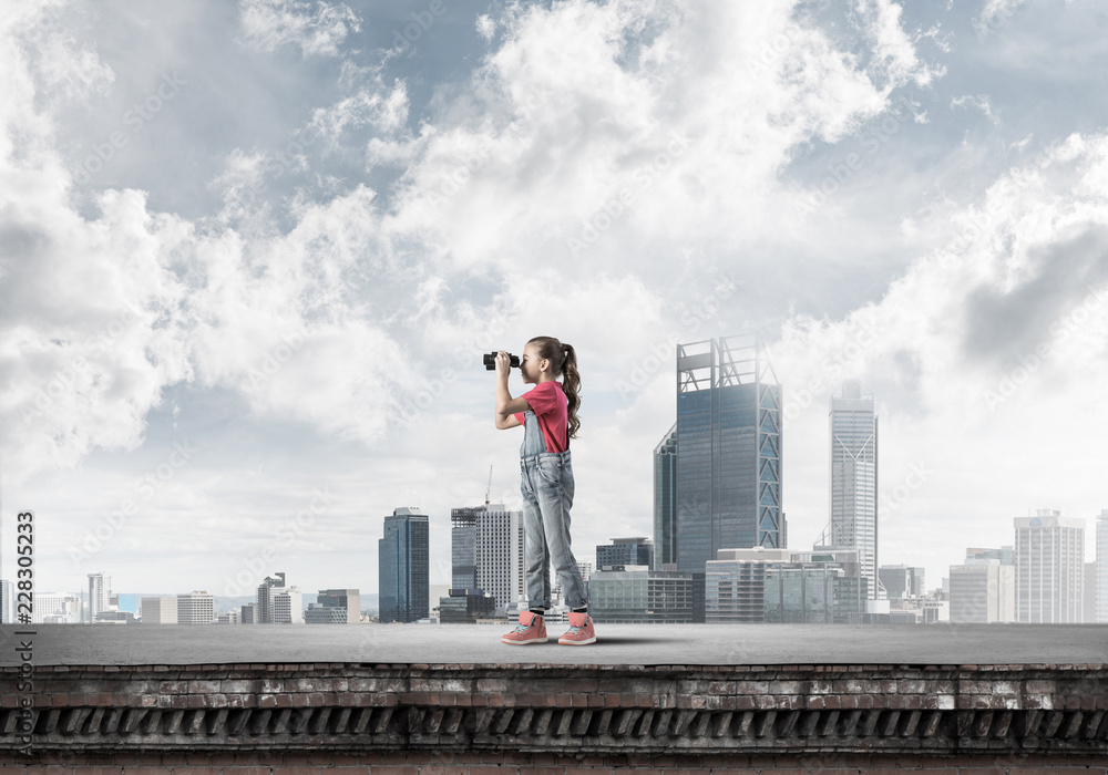 Concept of careless happy childhood with girl of school age look