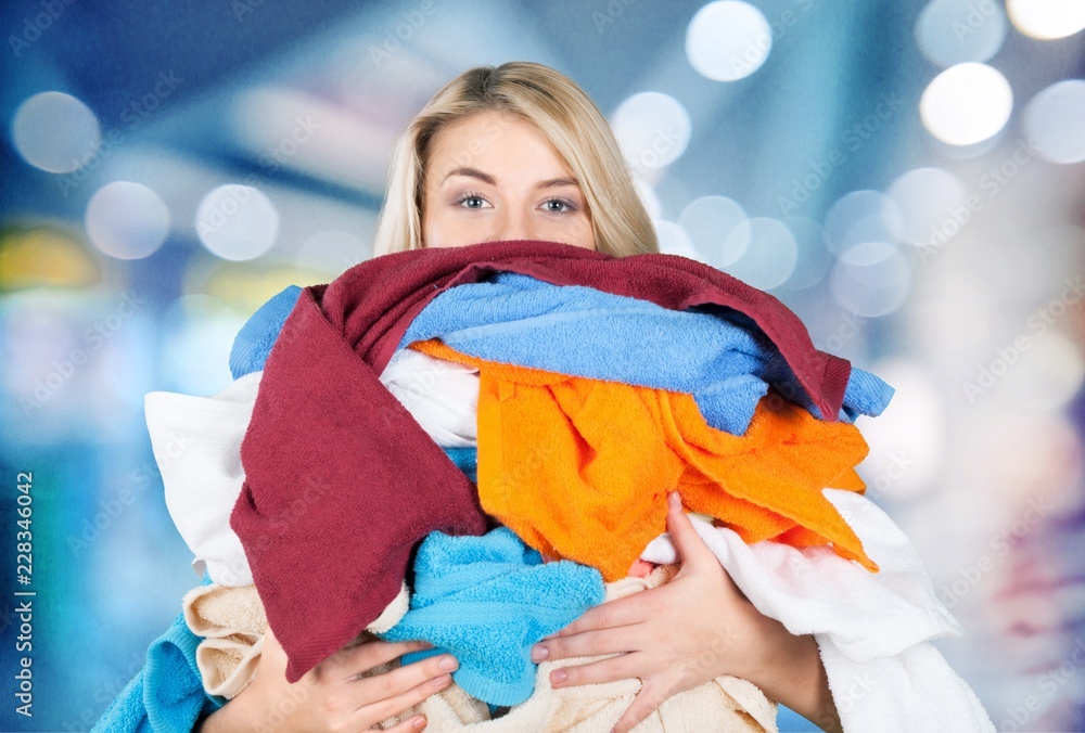 Young Tired Woman Carrying heap of different