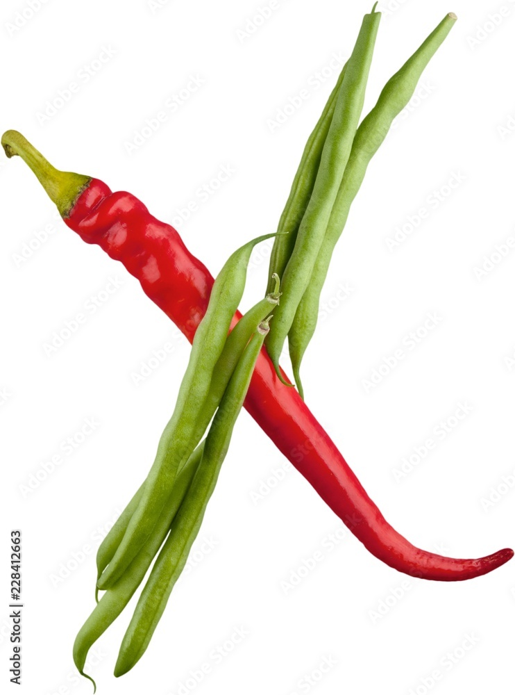 Close-up of vegetable alphabet with red pepper isolated on white