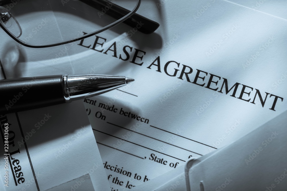 Lease Agreement Documents with Glasses and Pen