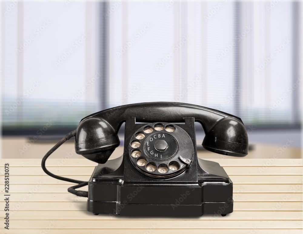 Old fashioned phone on desk