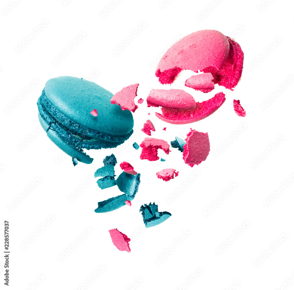 Macaroons is torn to pieces in the air on a white background