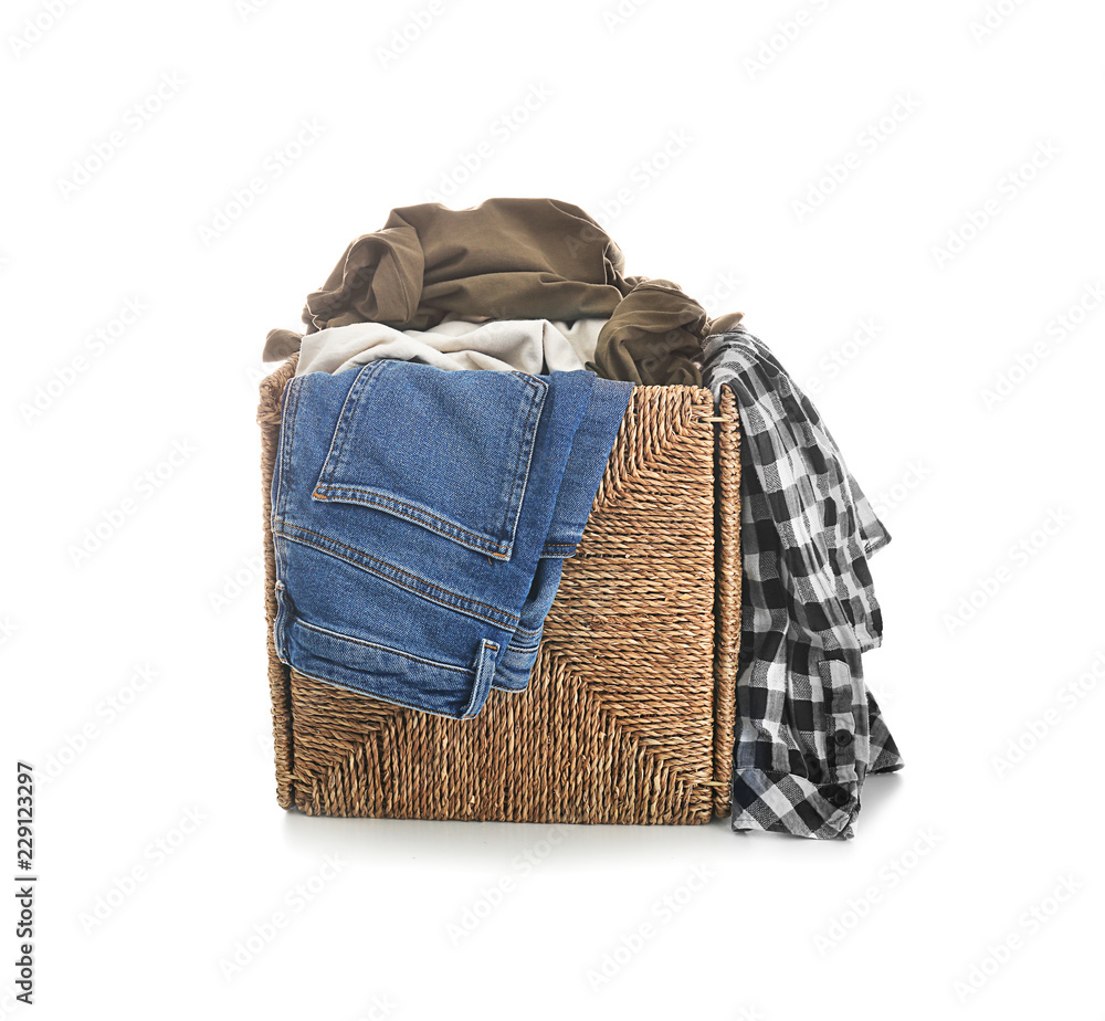 Laundry basket with dirty clothes on white background