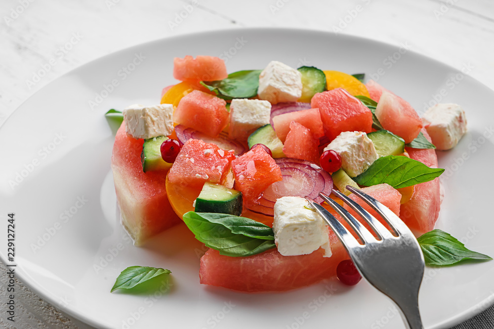 Delicious watermelon salad on plate, closeup