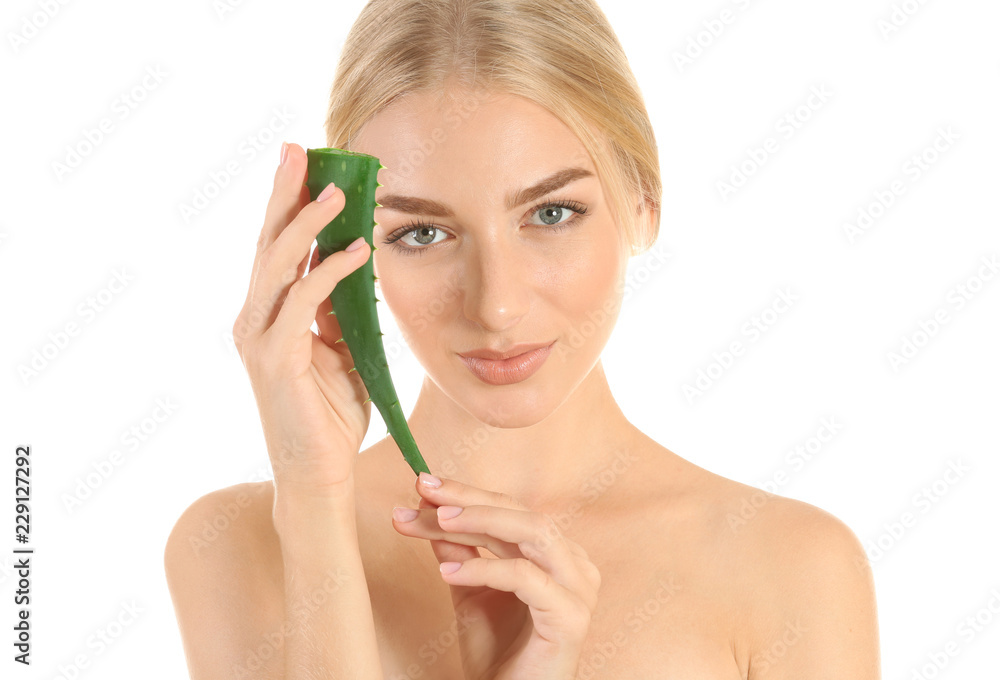 Beautiful young woman with aloe vera on white background