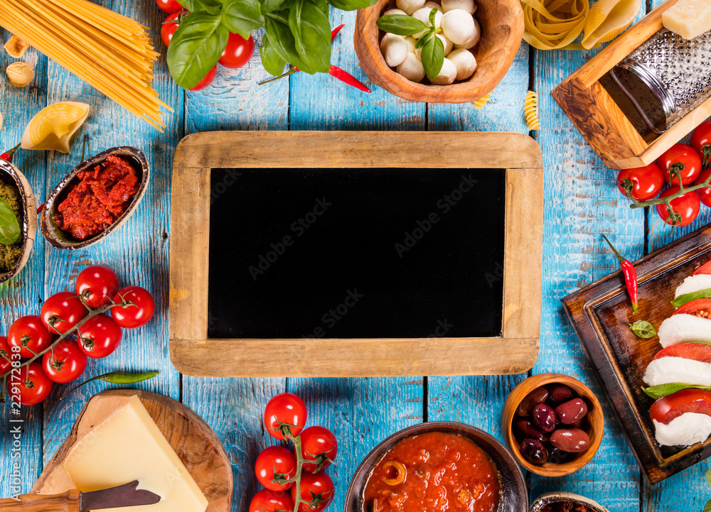 Various kind of italian food served on wood