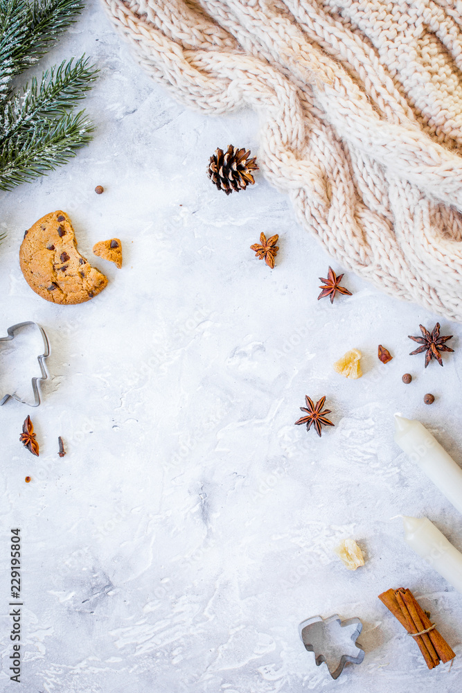 white knitted scarf and christmas decorations top view