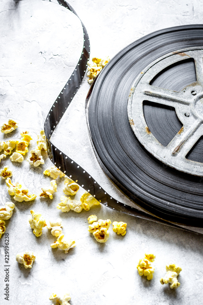 watching movie with popcorn on gray background close up