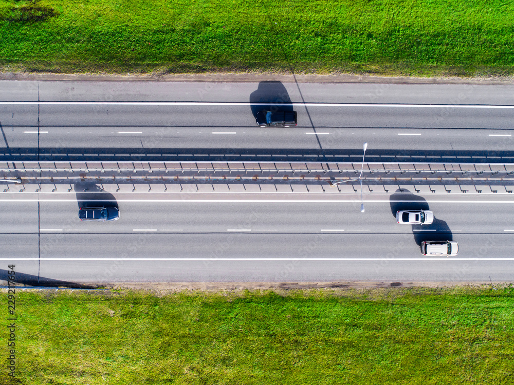 Aerial view of highway. Cars crossing interchange overpass. Highway interchange with traffic. Aerial