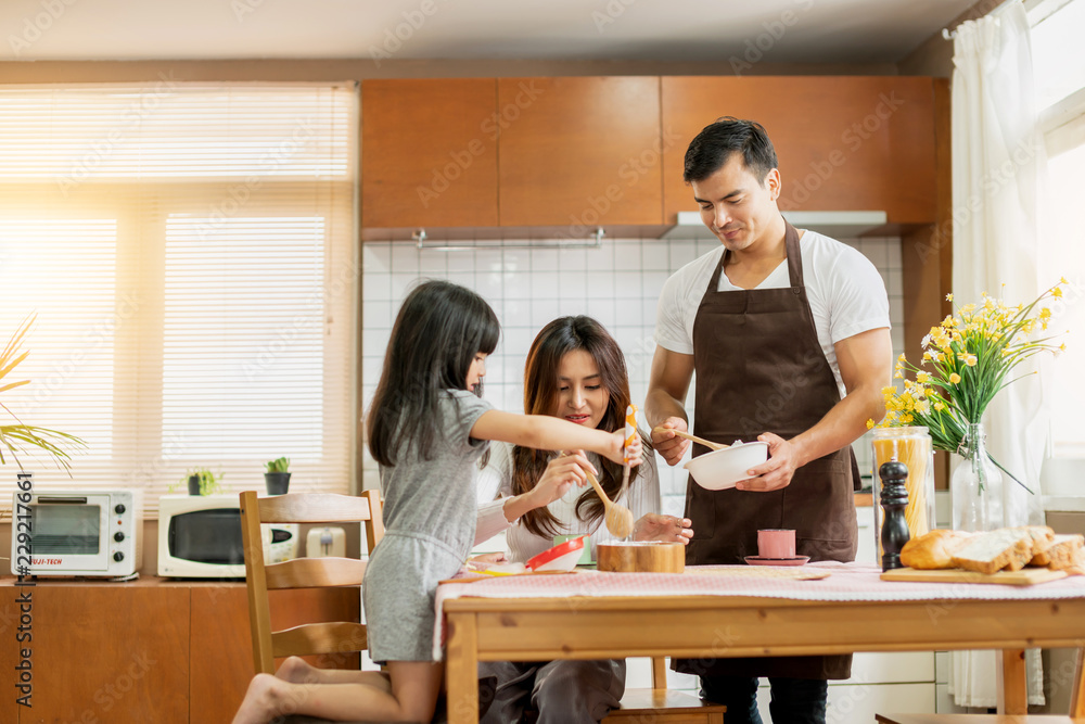 sweet family weekend activities cooking together with dad mom and daughter happiness moment and joyf