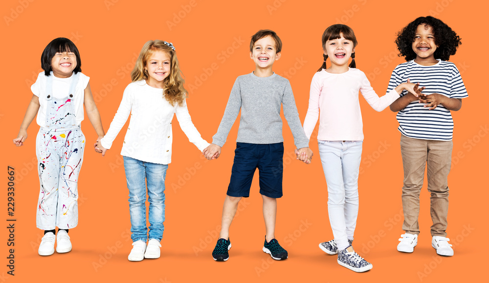 Cheerful kids holding hands