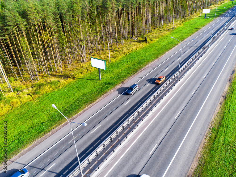 Aerial view of highway. Car crossing interchange overpass. Highway interchange with traffic. Aerial 