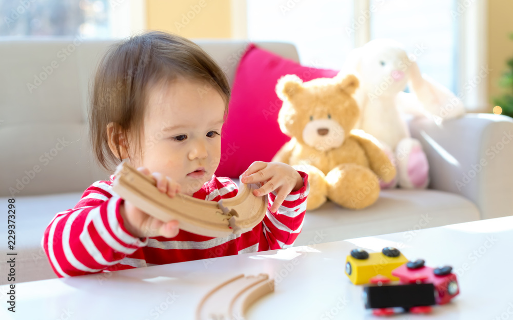 Toddler boy playing in his house around Christmas time