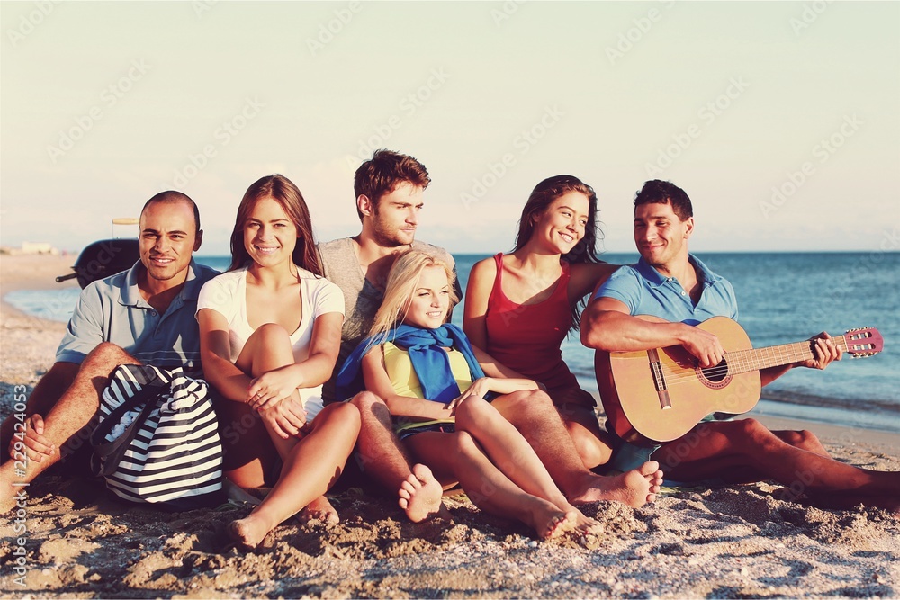 Happy friends making selfie on beach on summer day