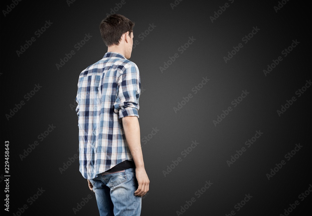 Handsome man standing in casual clothing on