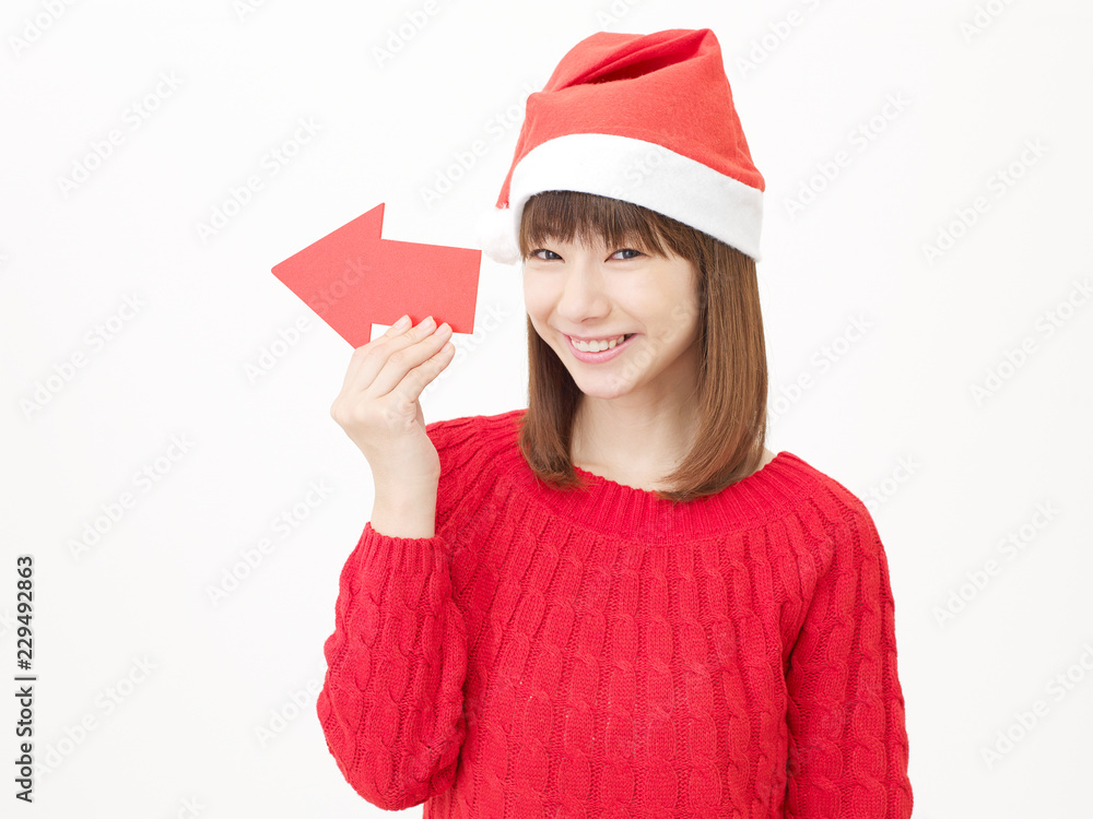 女性　クリスマス　矢印