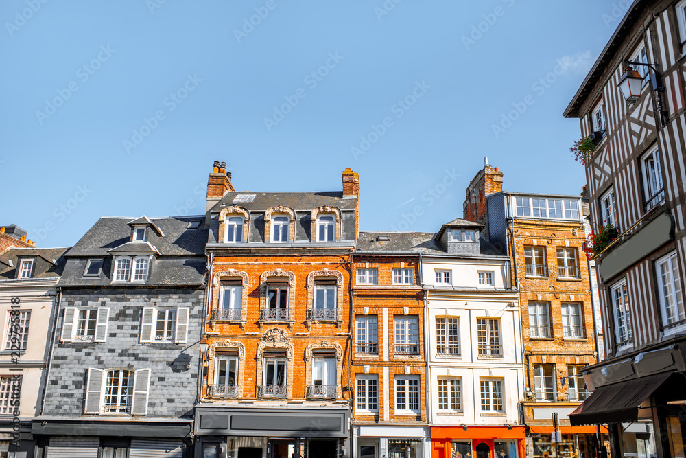 Beautiful facades of the old buildings in the central square in Honfleur, famous french town in Norm