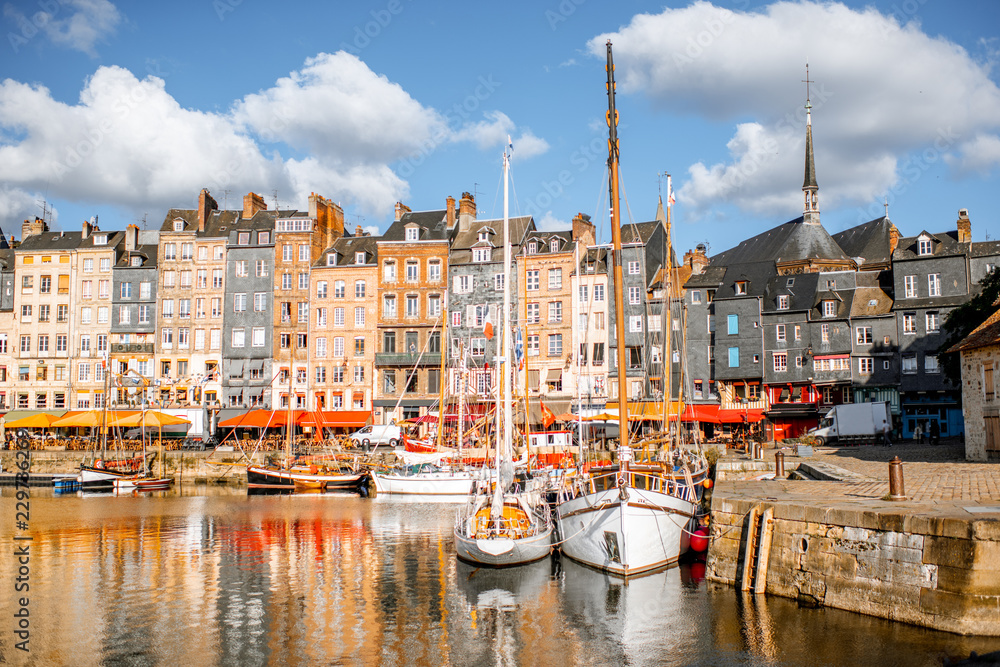 Landscape view of the harbour in Honfleur, famous french town in Normandy, during the morning light