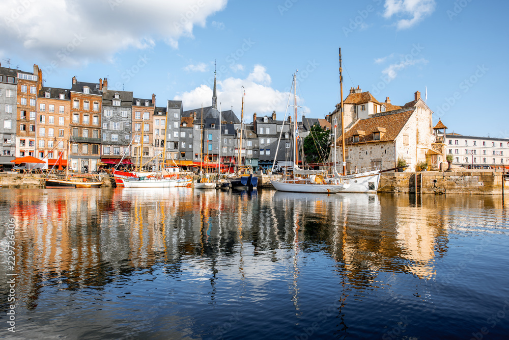 Landscape view of the harbour in Honfleur, famous french town in Normandy, during the morning light