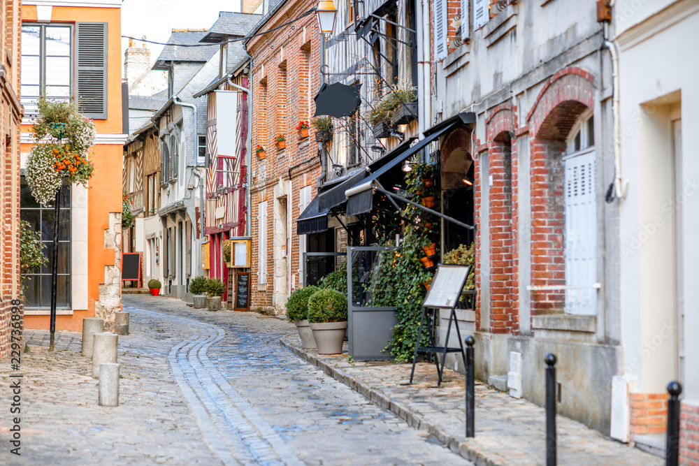 Street view with beautiful old buildings in Honfleur, famous french town in Normandy