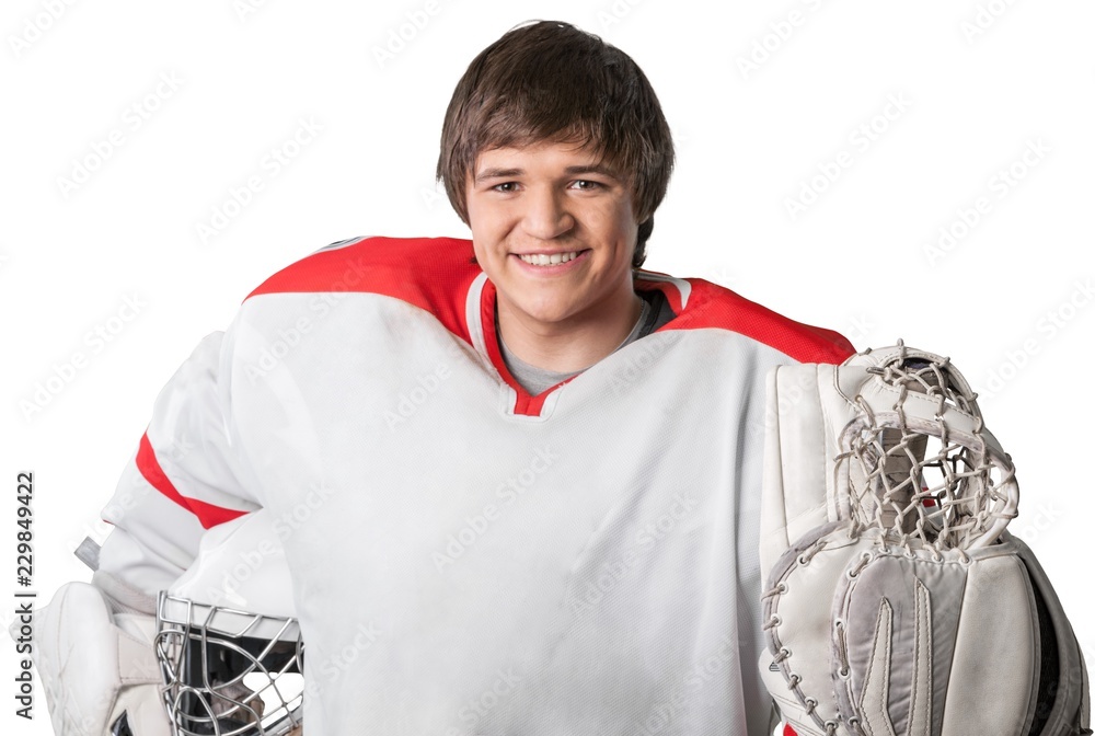 Young Hockey Goealie With Hockey Equipment. Isolated on