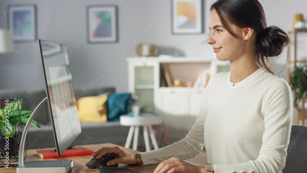 Portrait of the Beautiful Young Woman Working on Mobile Application Design on Her Personal Computer 