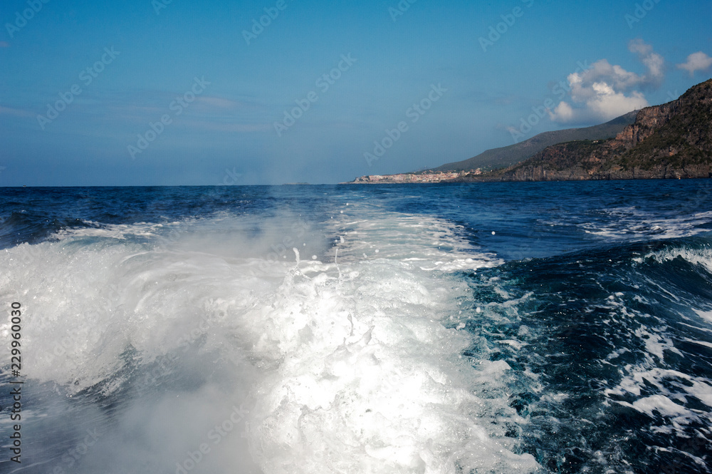 Wake of a powerboat leaving the village’s harbor