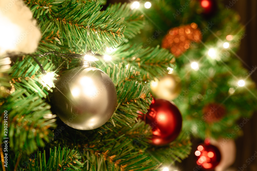 Close up christmas tree decorated with christmas balls and light