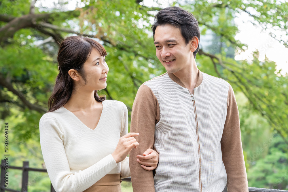 young asian couple in park