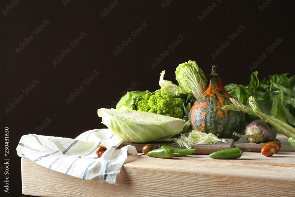 Various fresh vegetables on wooden table