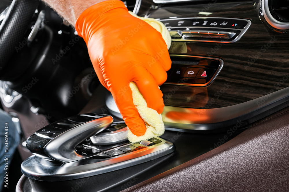 A man cleaning car with microfiber cloth. Car detailing. Selective focus. Car detailing. Cleaning wi