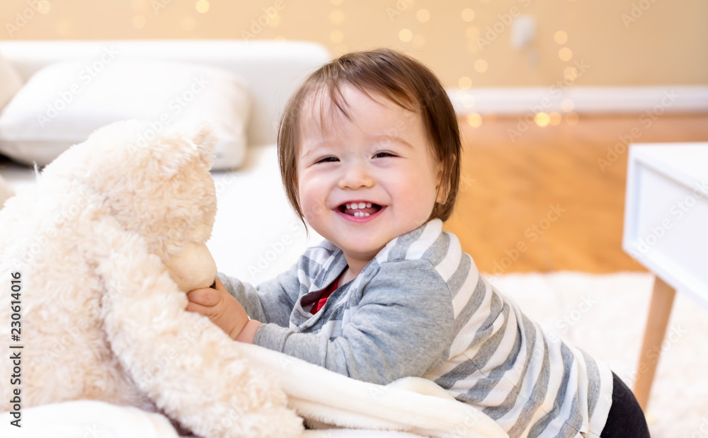 Happy toddler boy smiling in his house