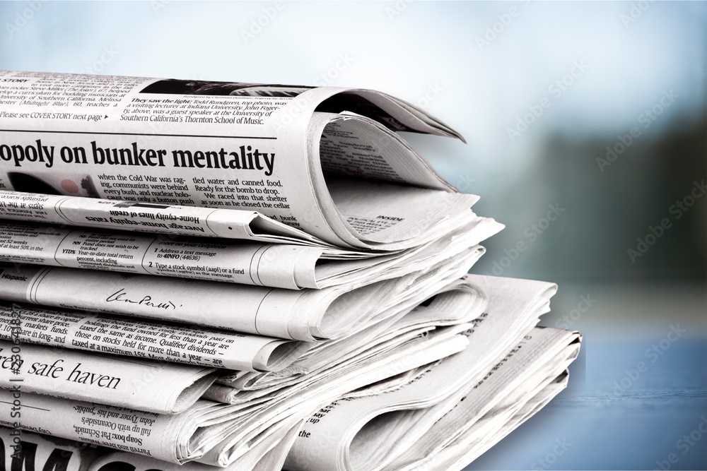 Pile of newspapers on  background close up