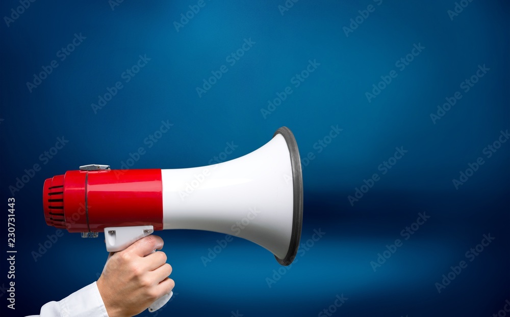 Close-up Human Hand with Megaphone on  background