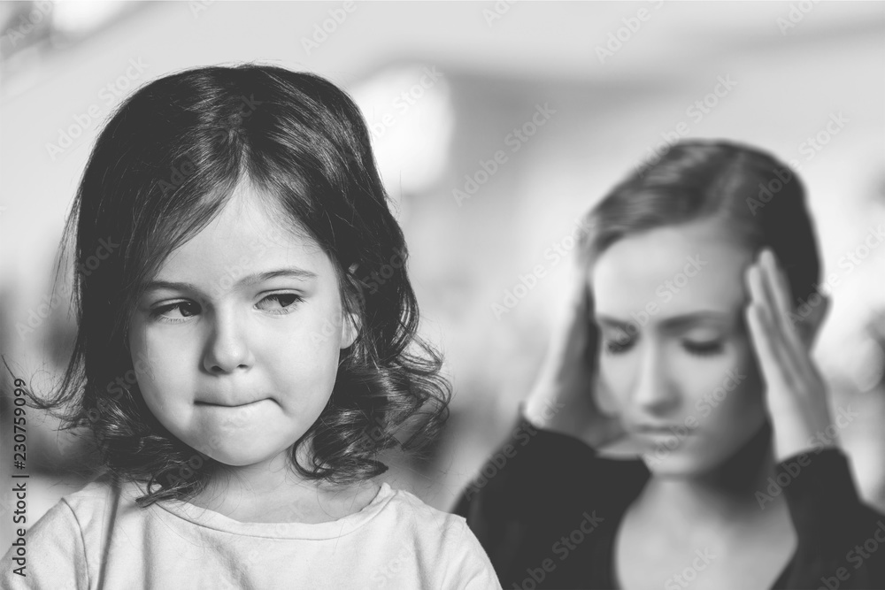 Sad Mother and daughter at home