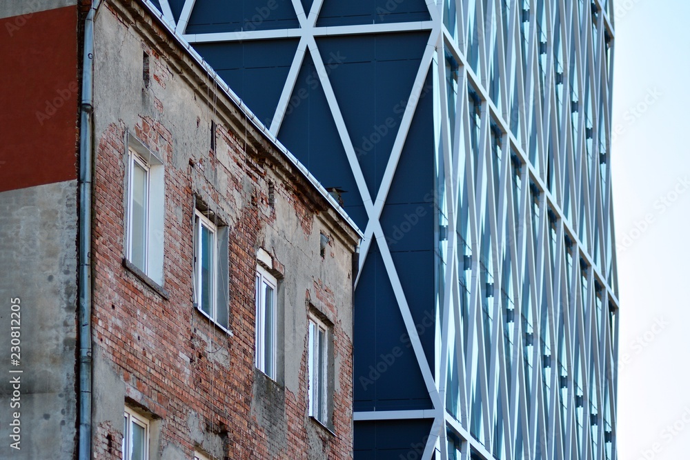 Modern office building facade abstract fragment, shiny windows in steel structure