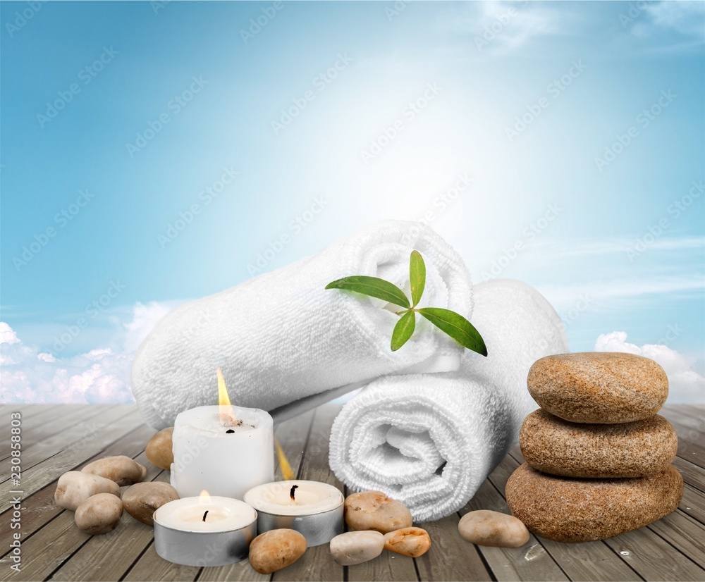 Laundry Basket with colorful towels on background