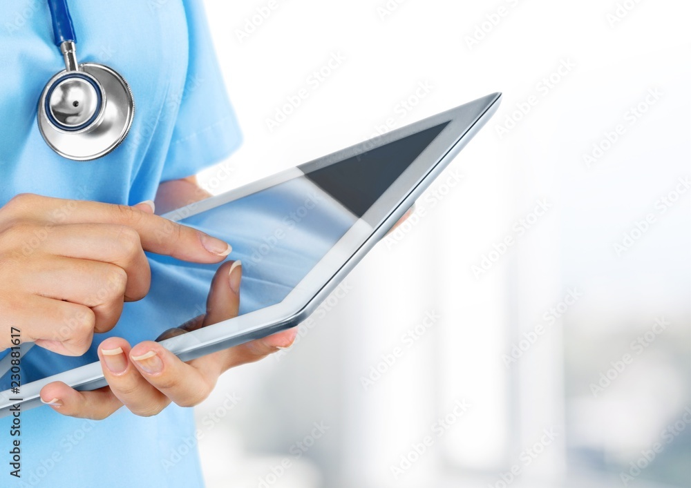 Close-up Doctor at hospital working with tablet pc