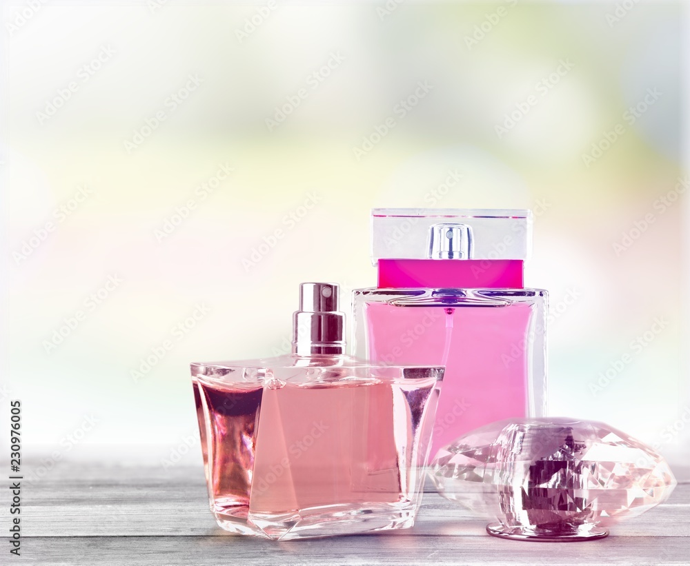 Aromatic Perfume bottles on background