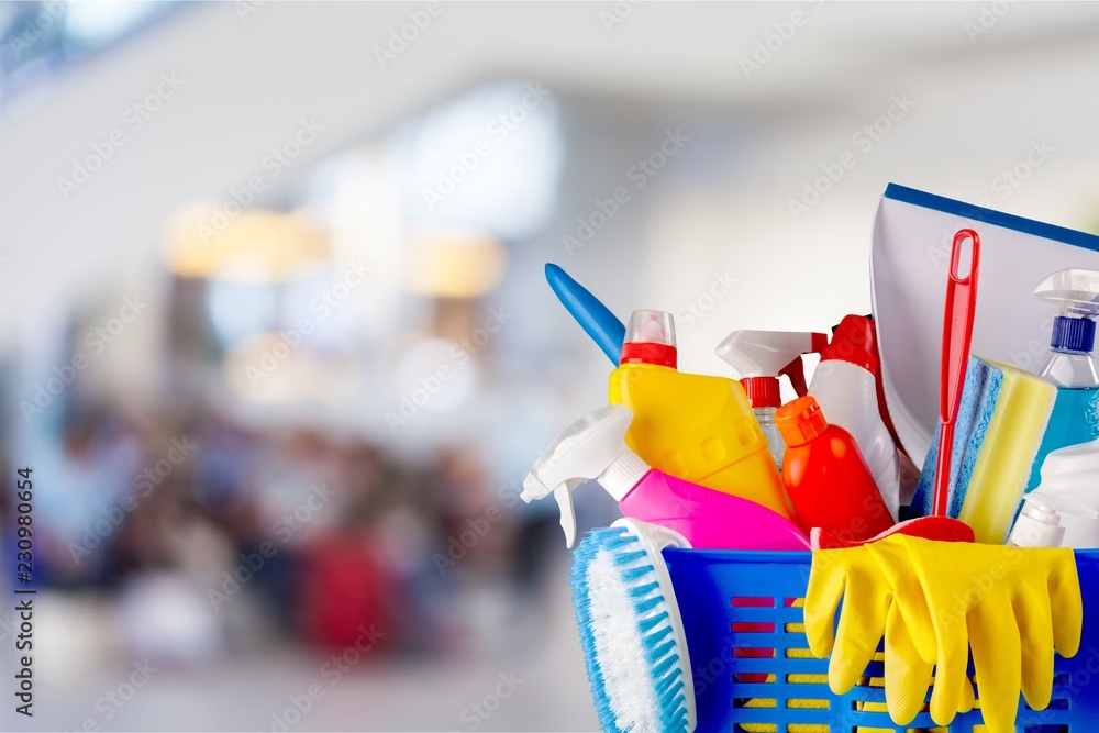 Plastic bottles, cleaning sponges and gloves on