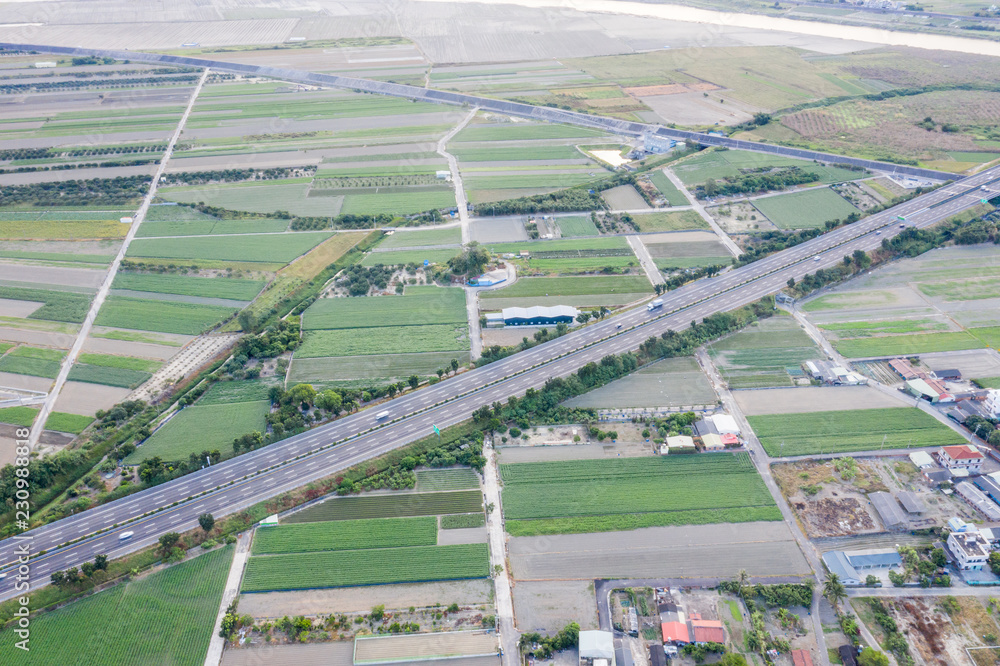 Fields with various types of agriculture and villages beside with air pollution in winter morning, T