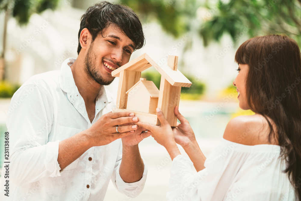 Young couple planning to buy a house and have happy living.