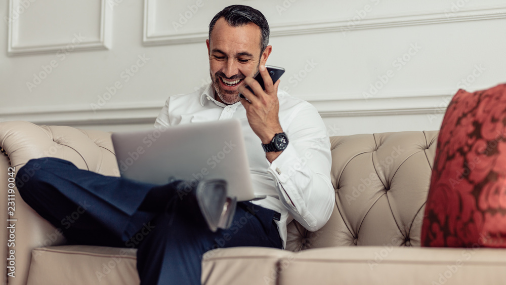 Businessman on tour working from hotel room